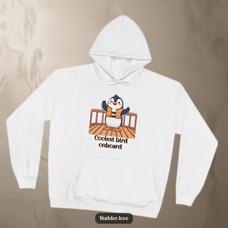 Funny hoodie with a playful penguin in a life jacket striking a triumphant pose on a deck, offering cozy celebratory vibes.